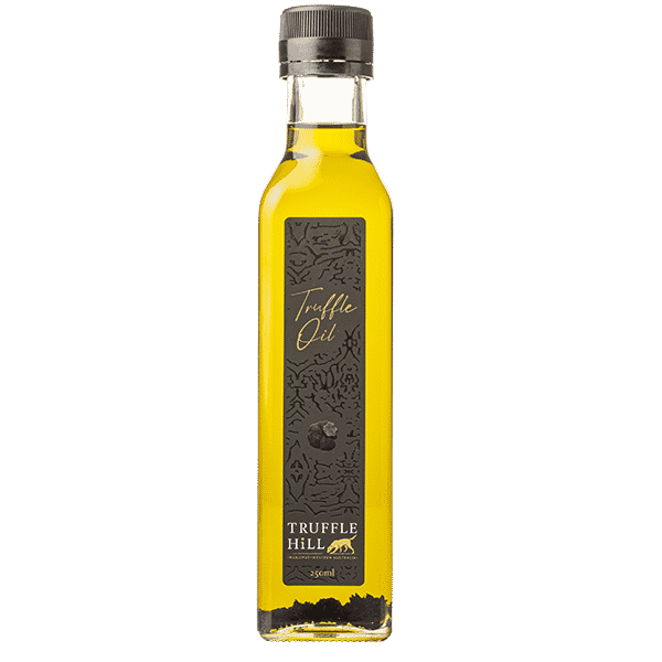 Golden glass bottle with a black label. Truffle Hill brand Truffle Oil.