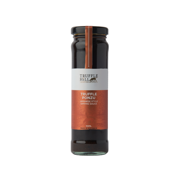 A tall round jar filled with a dark liquid. Black label with truffle hill brand on it and marked as Truffle Ponzu.